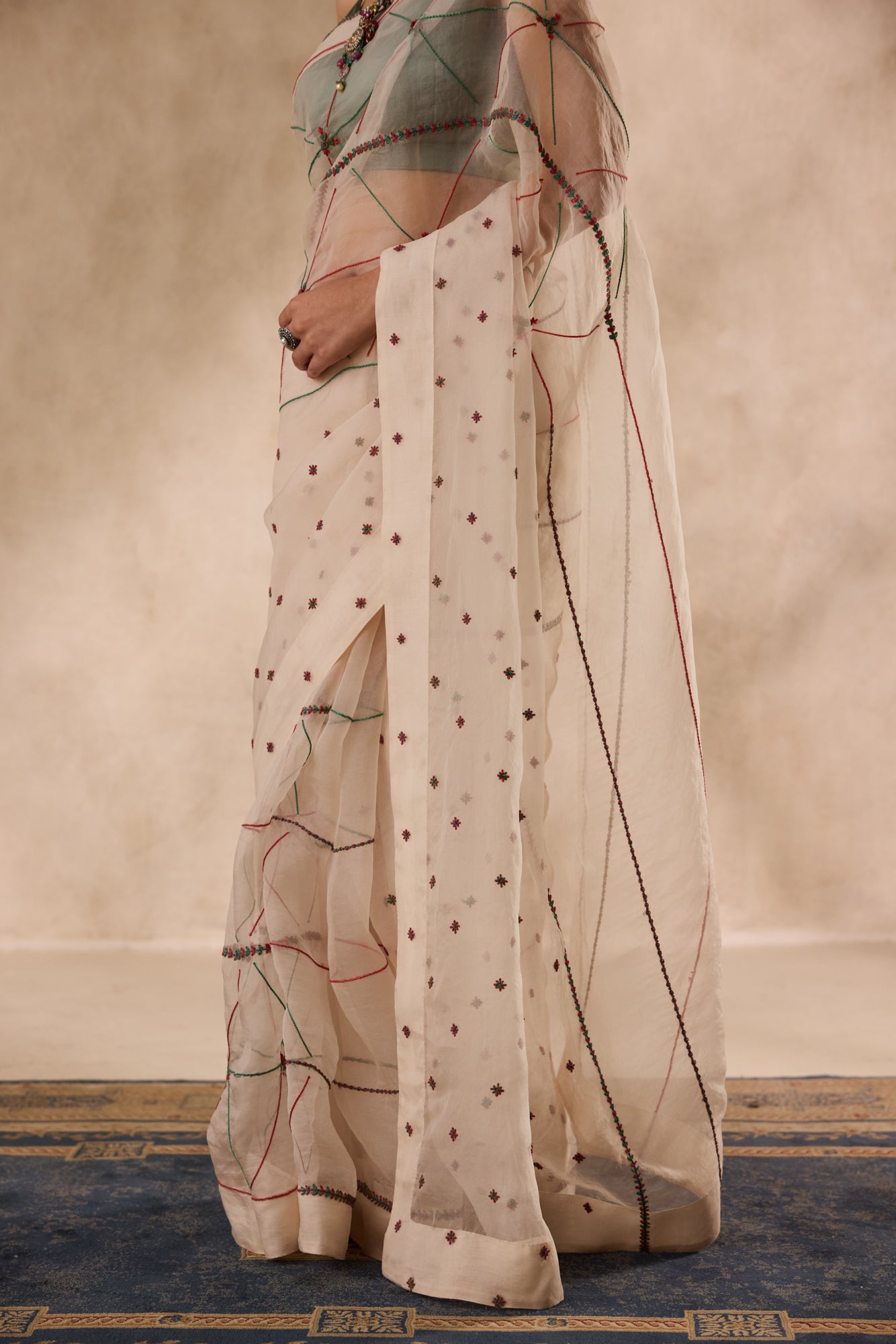Ivory organza resham and thread embroidered saree comes with unstitched & unembroidered blouse fabric in chanderi