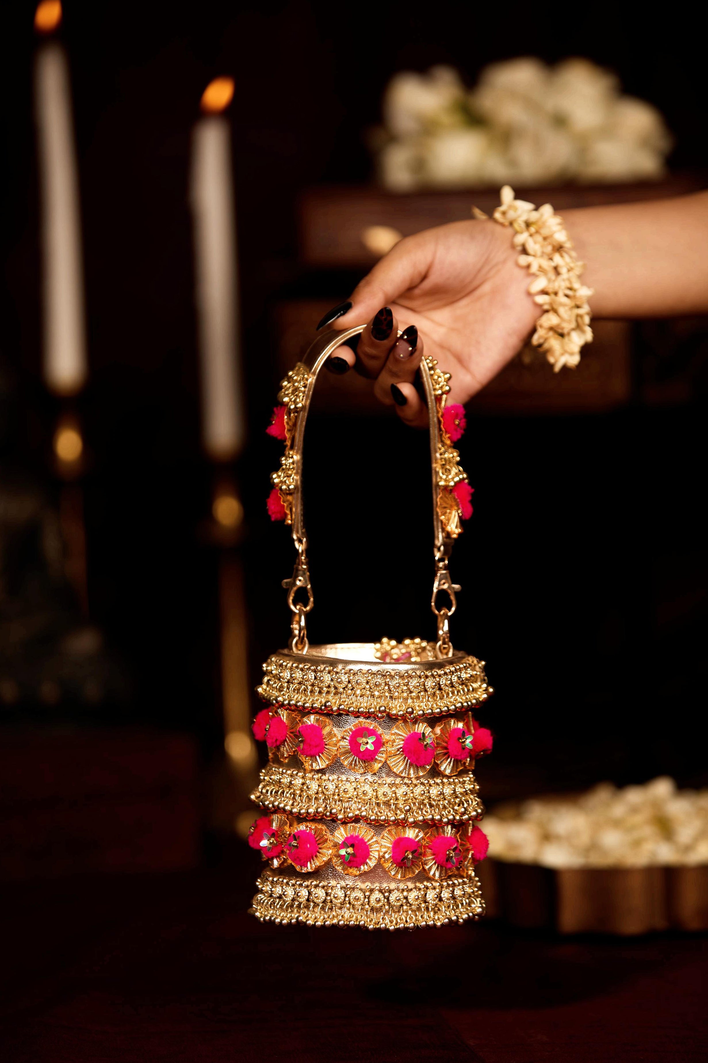 gold pompom handbag