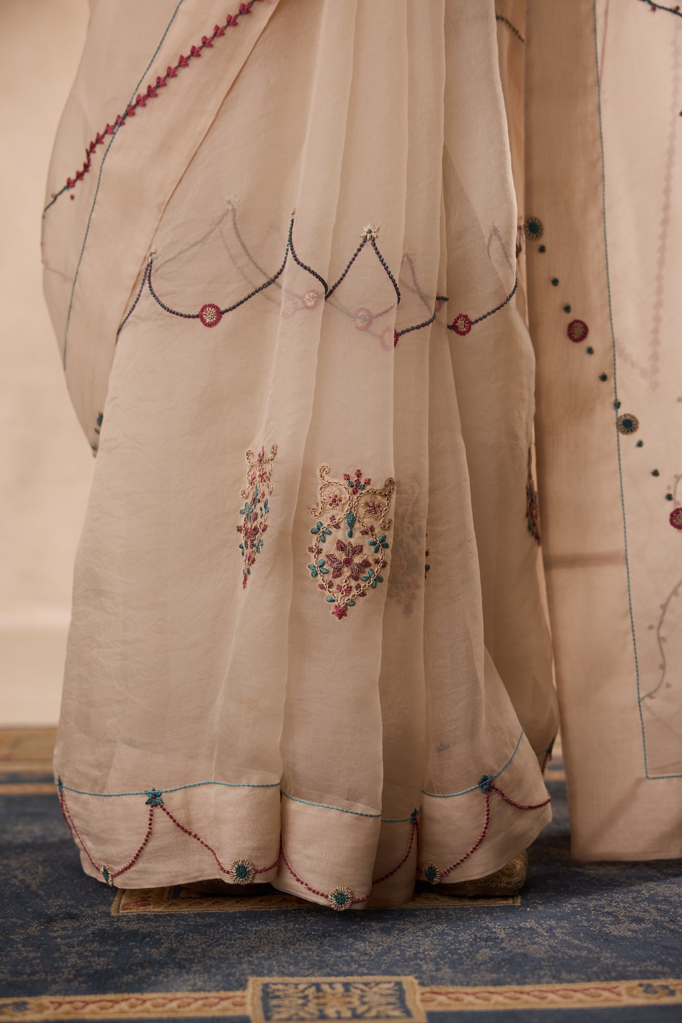 Ivory organza french knot jaal & paisley work saree comes with unstitched & unembroidered blouse fabric in chanderi