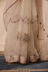 Ivory organza french knot jaal & paisley work saree comes with unstitched & unembroidered blouse fabric in chanderi
