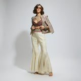 IVORY EMBELLISHED CAPE JACKET PAIRED WITH TEXTURED BUSTIER AND SHARARA PANTS