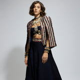 BLUE TEXTURED EMBELLISHED CAPE JACKET PAIRED WITH MASK APPLIQUE BUSTIER AND LEHENGA
