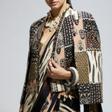 MASK AND FEATHER PRINT CASCADE SAREE PAIRED WITH METALLIC SCALLOP BUSTIER