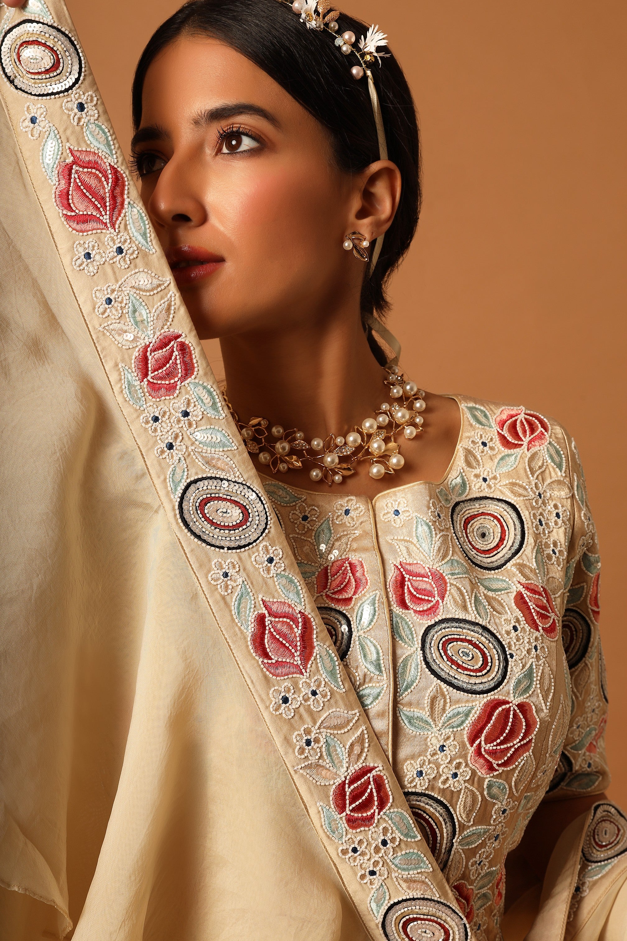 Beige embroidered blouse with gathered lehenga and dupatta