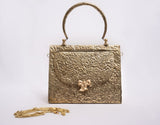 TRIANGLE HAMMERED BRASS BOW BAG IN GOLD