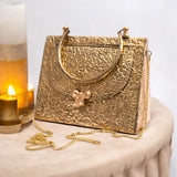 TRIANGLE HAMMERED BRASS BOW BAG IN GOLD