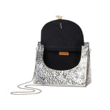TRIANGLE HAMMERED BRASS BOW BAG IN SILVER