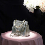TRIANGLE HAMMERED BRASS BOW BAG IN SILVER