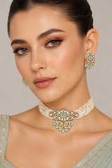 Elegant and classy two tone kundan choker set with mint green stones and pearls