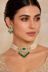 Elegant and classy two tone kundan choker set with green stones and pearls