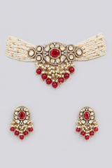 Elegant and classy two tone kundan choker set with red stones and pearls