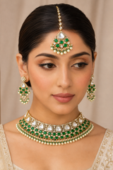 Bold and dramatic polki bridal necklace set with matching earrings and maangtika