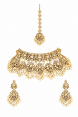Bold and dramatic polki bridal necklace set with matching earrings and maangtika