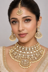 Bold and dramatic polki bridal necklace set with matching earrings and maangtika