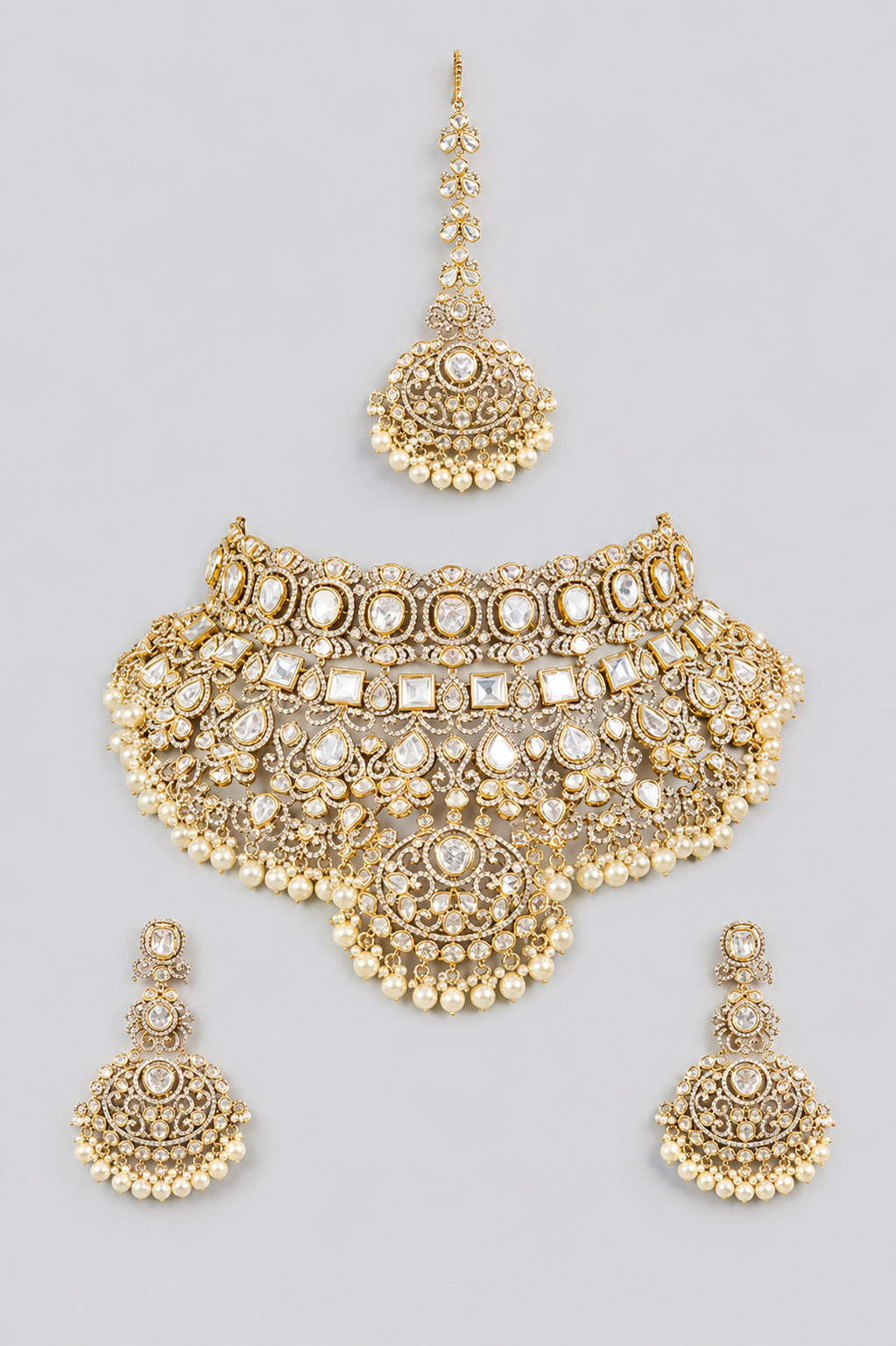 Bold and dramatic polki bridal necklace set with matching earrings and maangtika