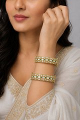 Bold and dramatic polki pair of bangles in two tone finish