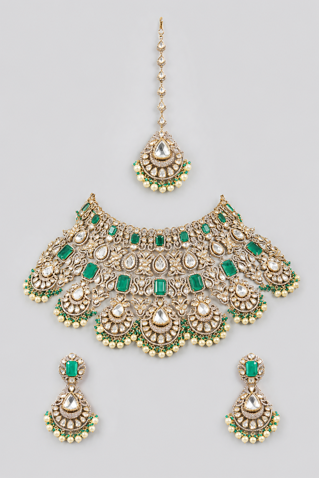 Bold and dramatic polki bridal necklace set with matching earrings and maangtika