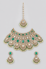 Bold and dramatic polki bridal necklace set with matching earrings and maangtika