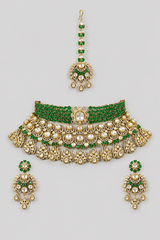Bold and dramatic polki bridal necklace set with matching earrings and maangtika