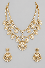 Elegant and dramatic long necklace set with kundan stones set in paisley design. It comes with a pair of matching earrings