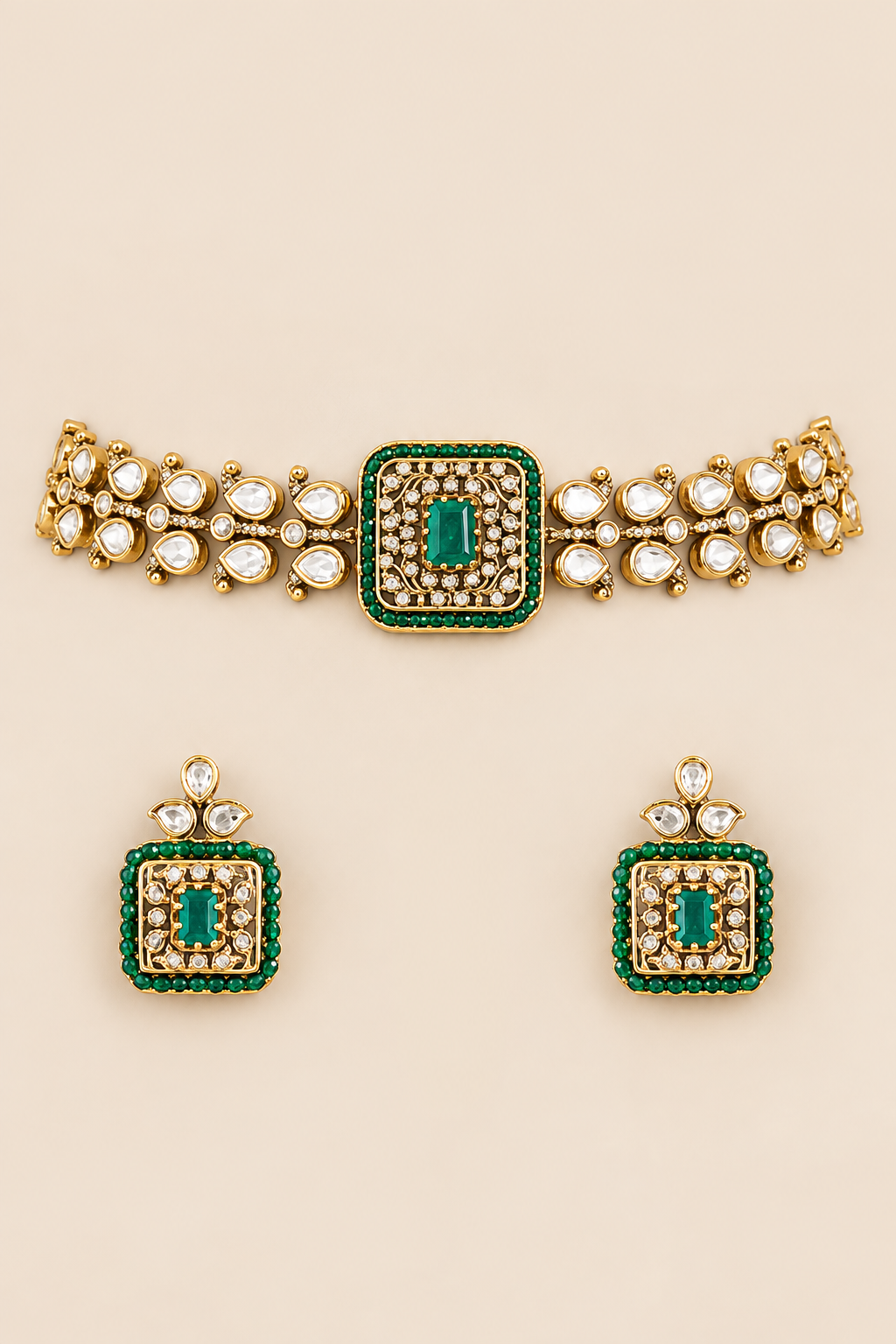 Exclusive and classic two tone finish choker with green stones. It comes with a pair of matching studs.