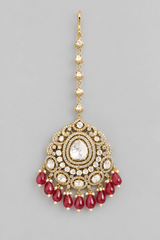 Bold and dramatic kundan polki maangtika with red pearls