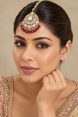 Bold and dramatic kundan polki maangtika with red pearls