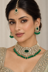 Elegant and classy two tone kundan choker set with green stones and pearls