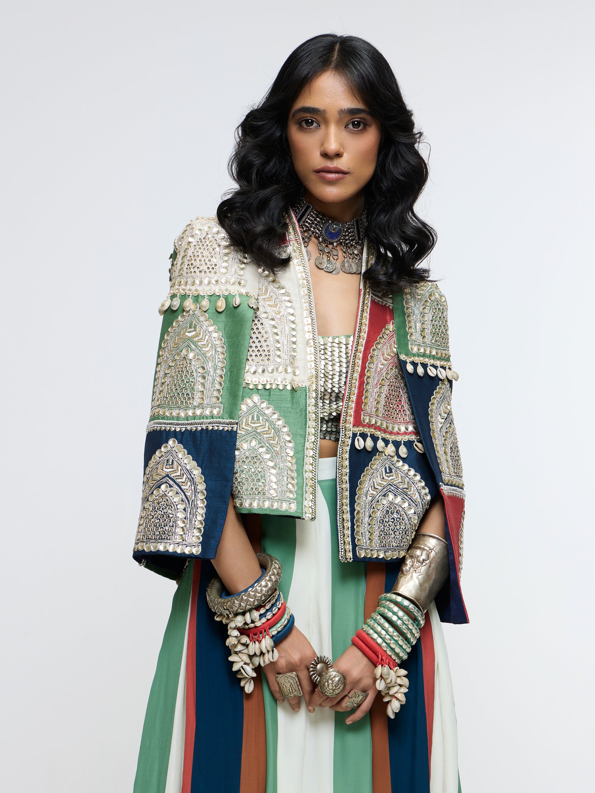 RAJRANGI EMBELLISHED CAPE JACKET PAIRED WITH EMBELLISHED BUSTIER AND PLEATED PANTS