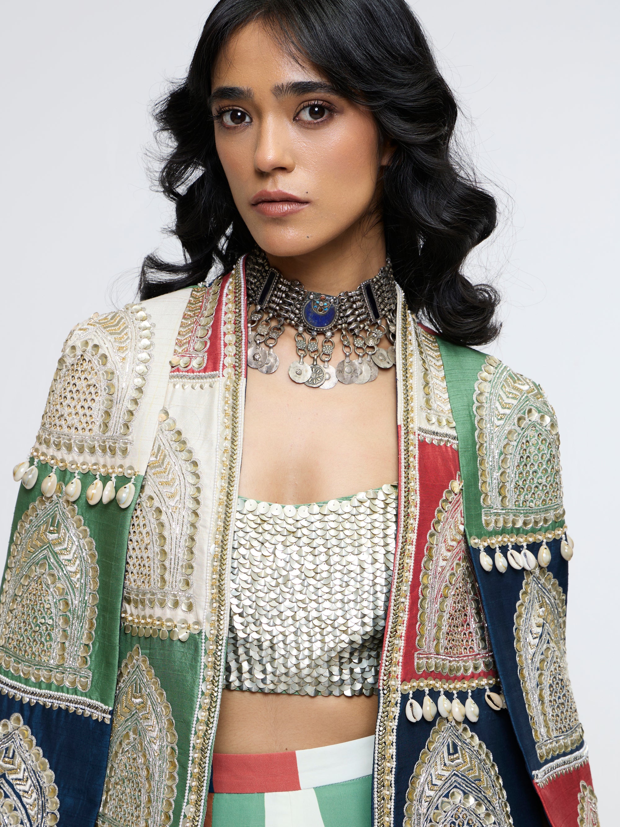 RAJRANGI EMBELLISHED CAPE JACKET PAIRED WITH EMBELLISHED BUSTIER AND PLEATED PANTS