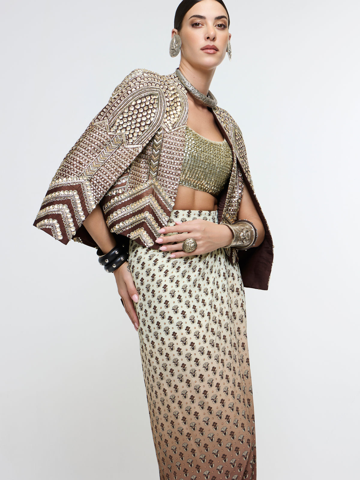 NAZNEEN CAPE JACKET PAIRED WITH METALLIC BUSTIER & SLIT SKIRT