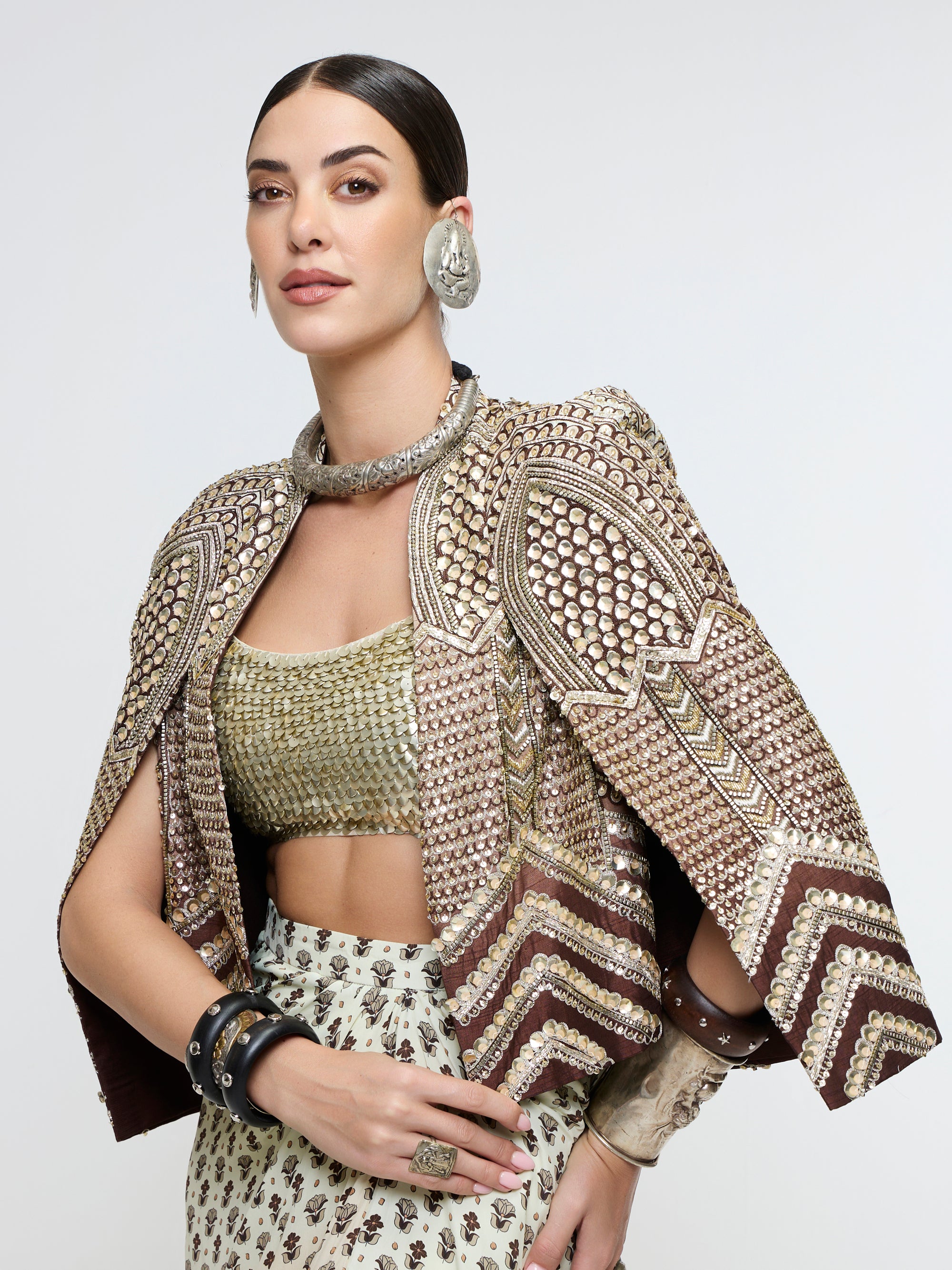 NAZNEEN CAPE JACKET PAIRED WITH METALLIC BUSTIER & SLIT SKIRT