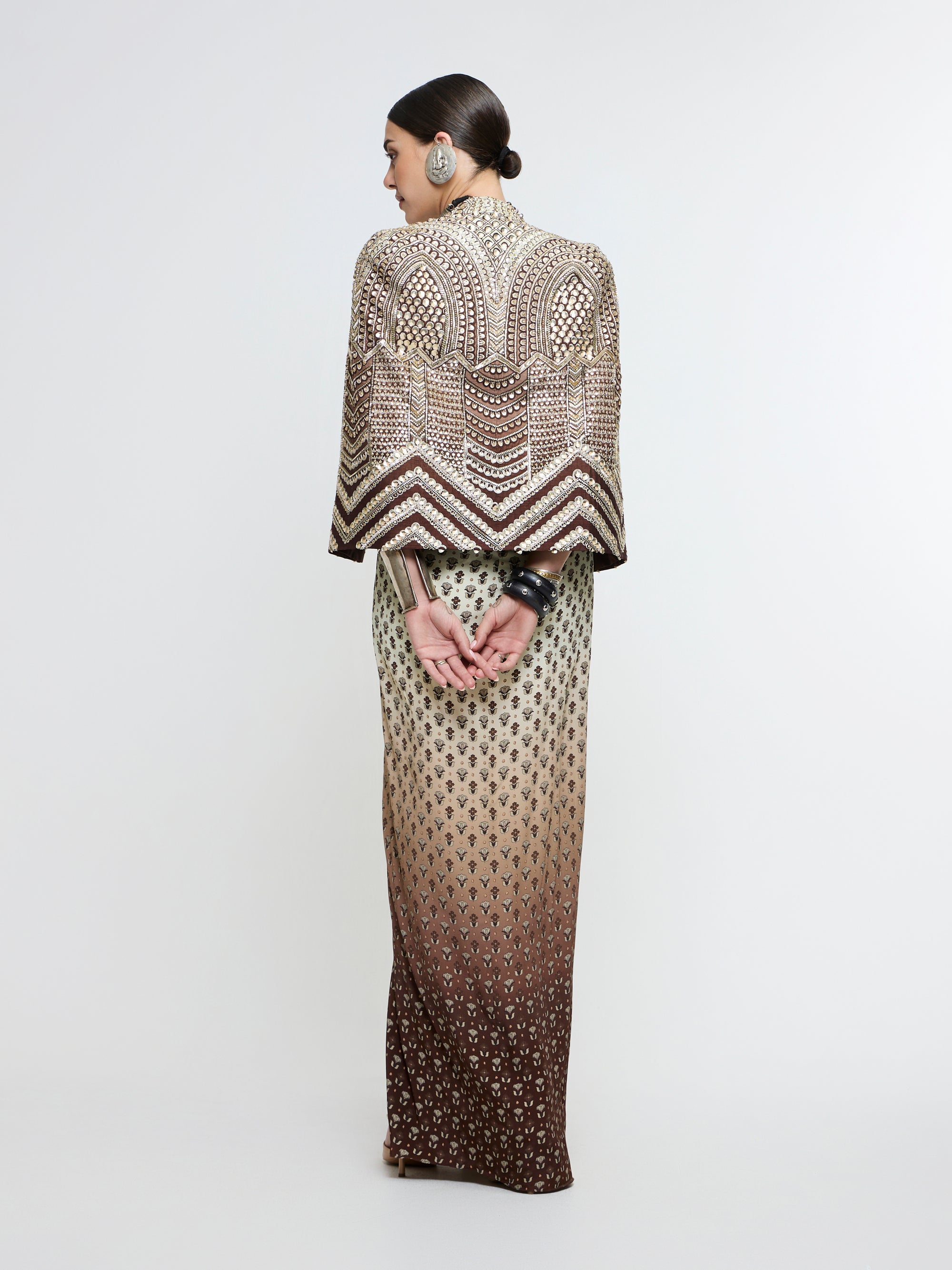 NAZNEEN CAPE JACKET PAIRED WITH METALLIC BUSTIER & SLIT SKIRT