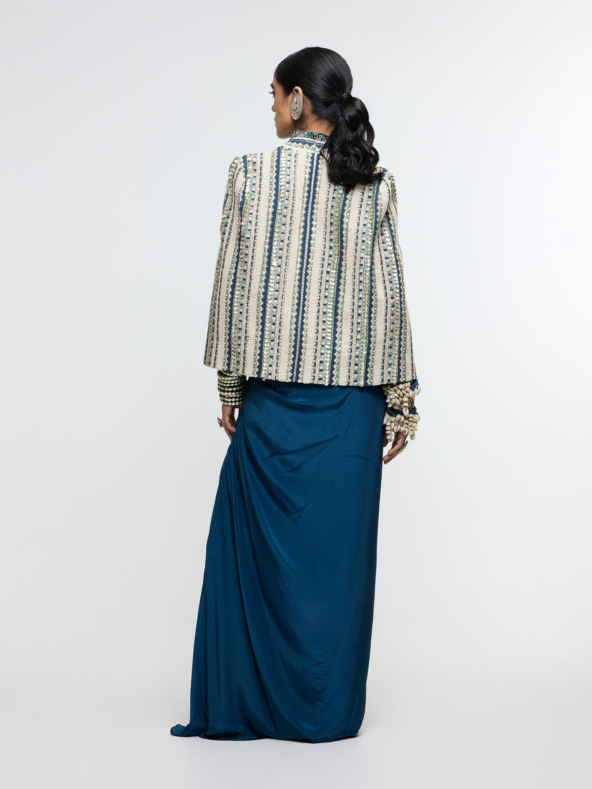 INAAYA EMBLLISHED & TEXTURED JACKET PAIRED WITH METALLIC BUSTIER AND SLIT SKIRT