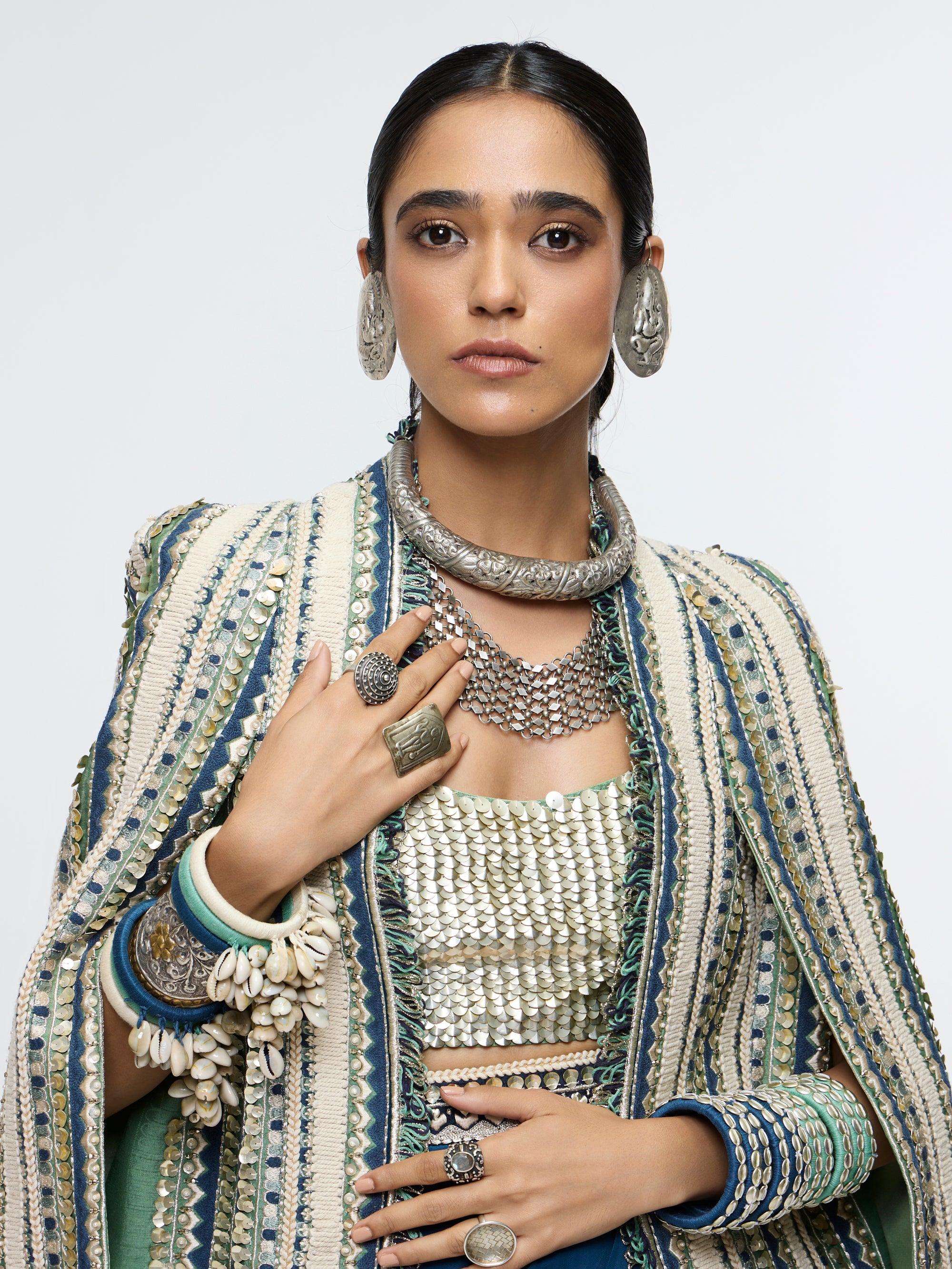 INAAYA EMBLLISHED & TEXTURED JACKET PAIRED WITH METALLIC BUSTIER AND SLIT SKIRT