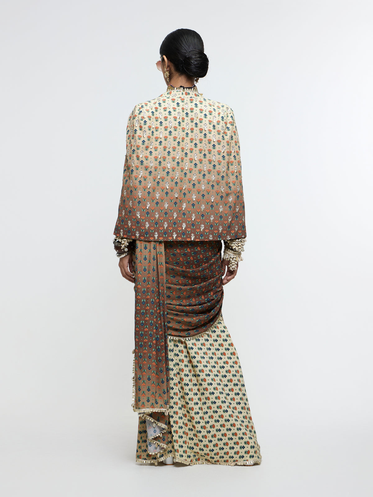 MAHNOOR CAPE JACKET PAIRED WITH METALLIC BUSTIER & DRAPE SAREE