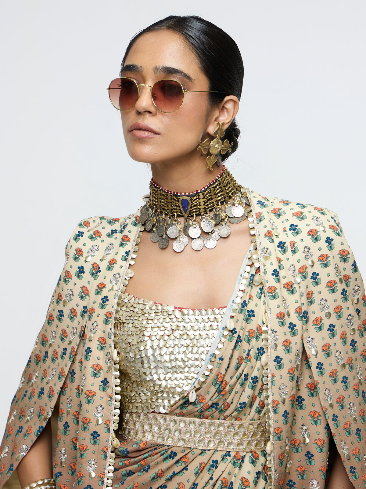 MAHNOOR CAPE JACKET PAIRED WITH METALLIC BUSTIER & DRAPE SAREE