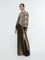 AMER JACKET PAIRED WITH EMBELLISHED BUSTIER AND HIGH-SLIT SKIRT