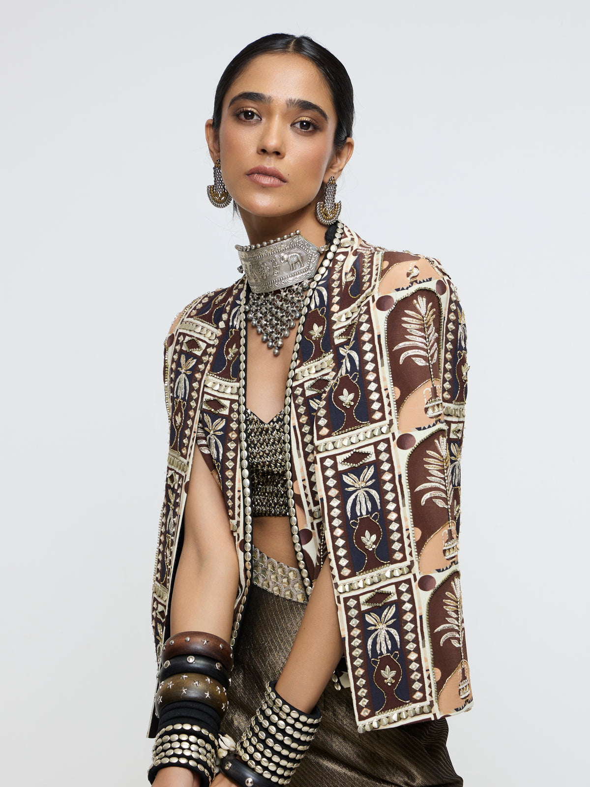 AMER JACKET PAIRED WITH EMBELLISHED BUSTIER AND HIGH-SLIT SKIRT