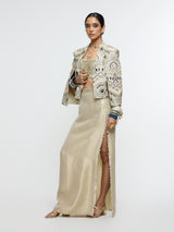 INAYAT EMBELLISHED CAPE JACKET PAIRED WITH METALLIC SCALLOP BUSTIER AND IVORY SLIT SKIRT