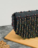 Semi circle tassle clutch