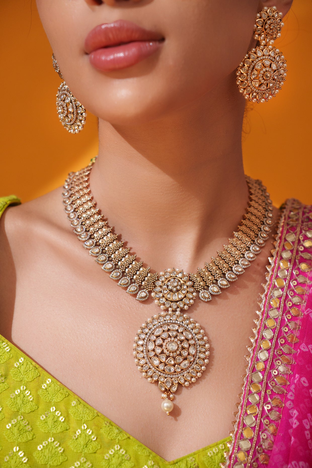 Bold and dramatic kundan pendant necklace with earrings