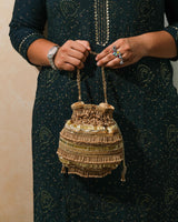 Golden polma tassel potli