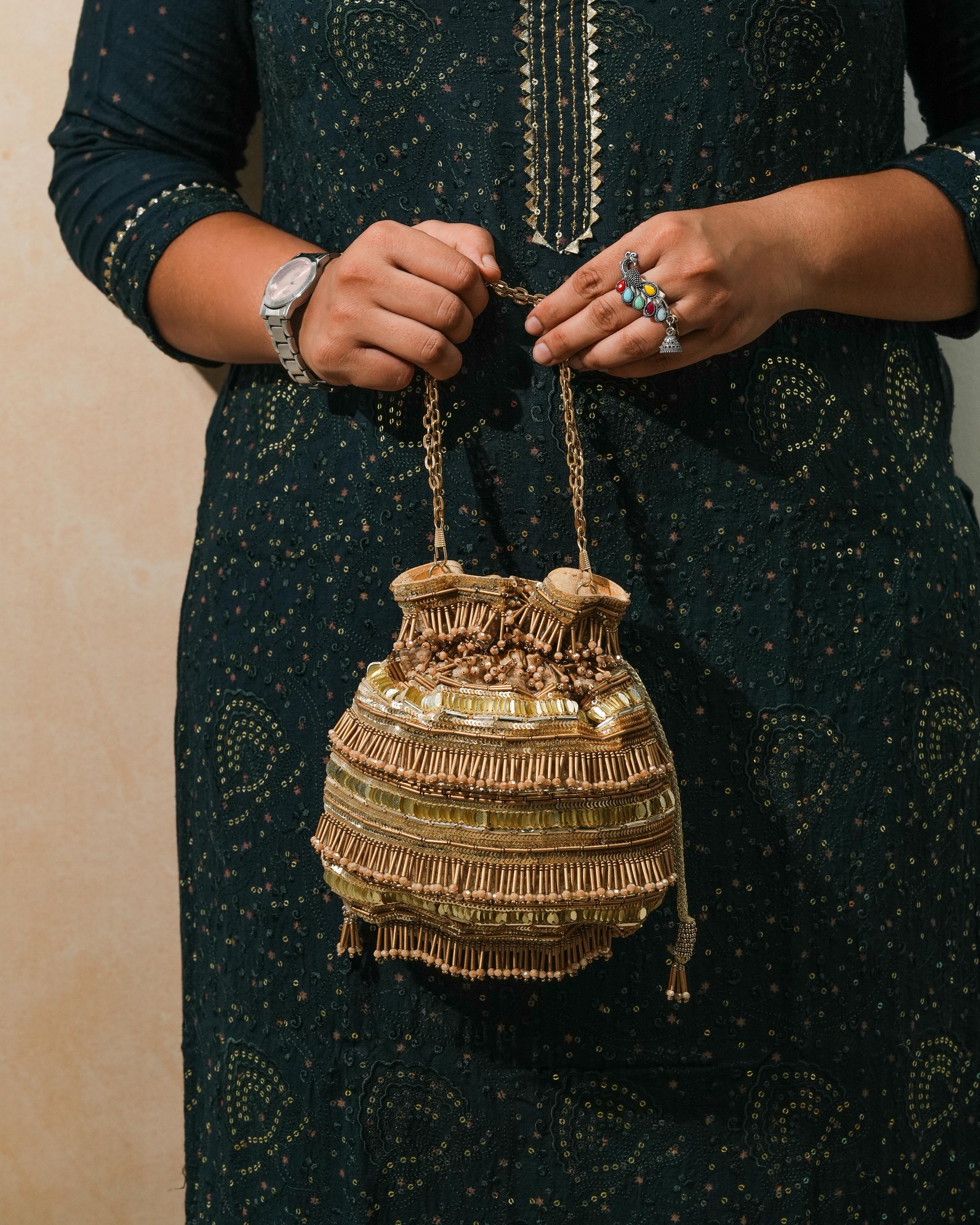 Golden polma tassel potli