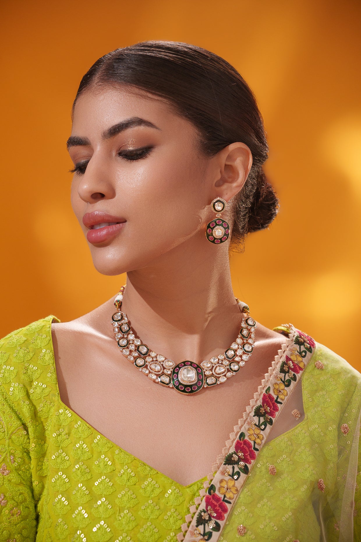 Classy kundan meena necklace set with elegant pair of earrings.