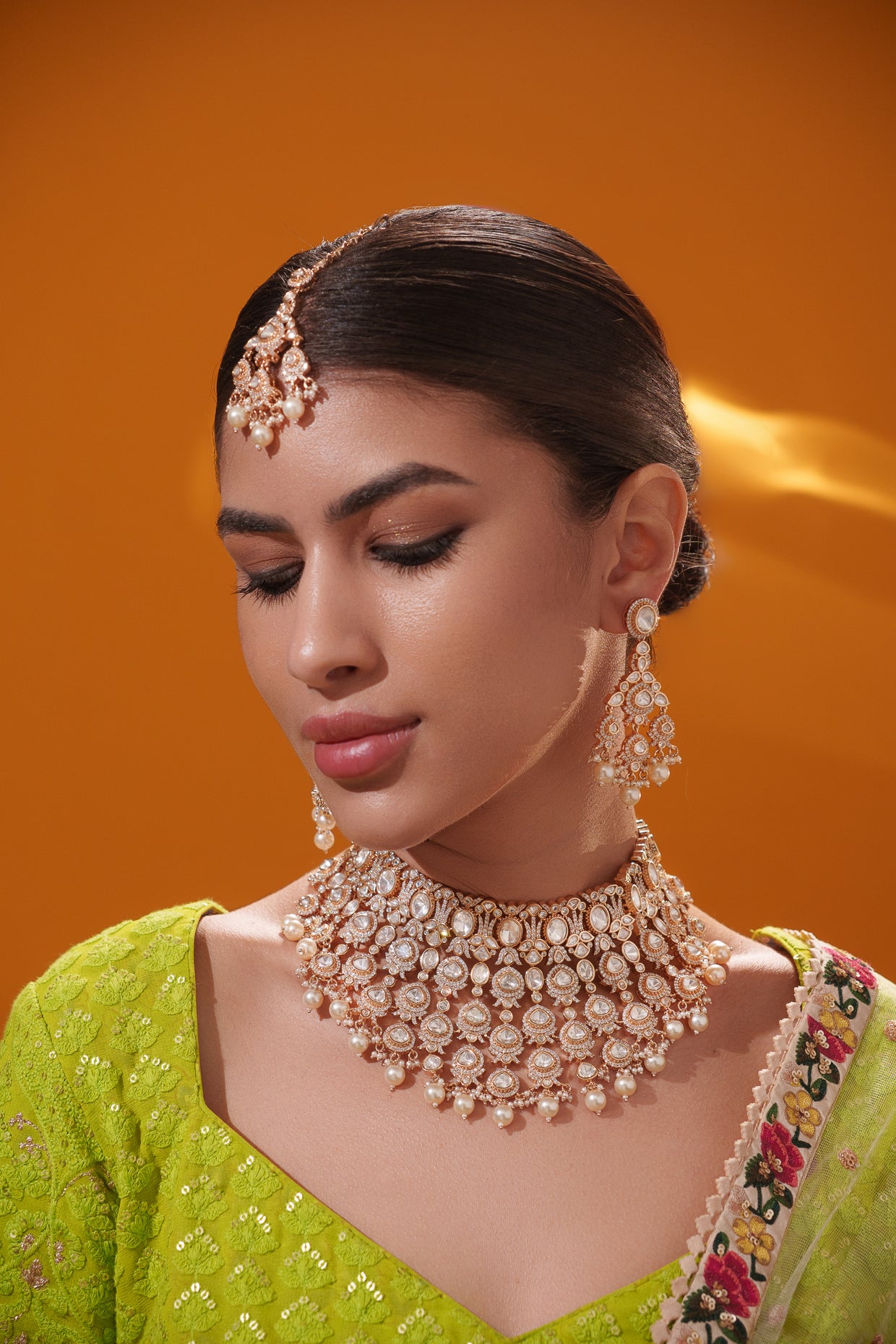 Traditional yet dramatic kundan necklace set with matching earrings and maangtika