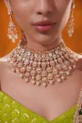 Traditional yet dramatic kundan necklace set with matching earrings and maangtika