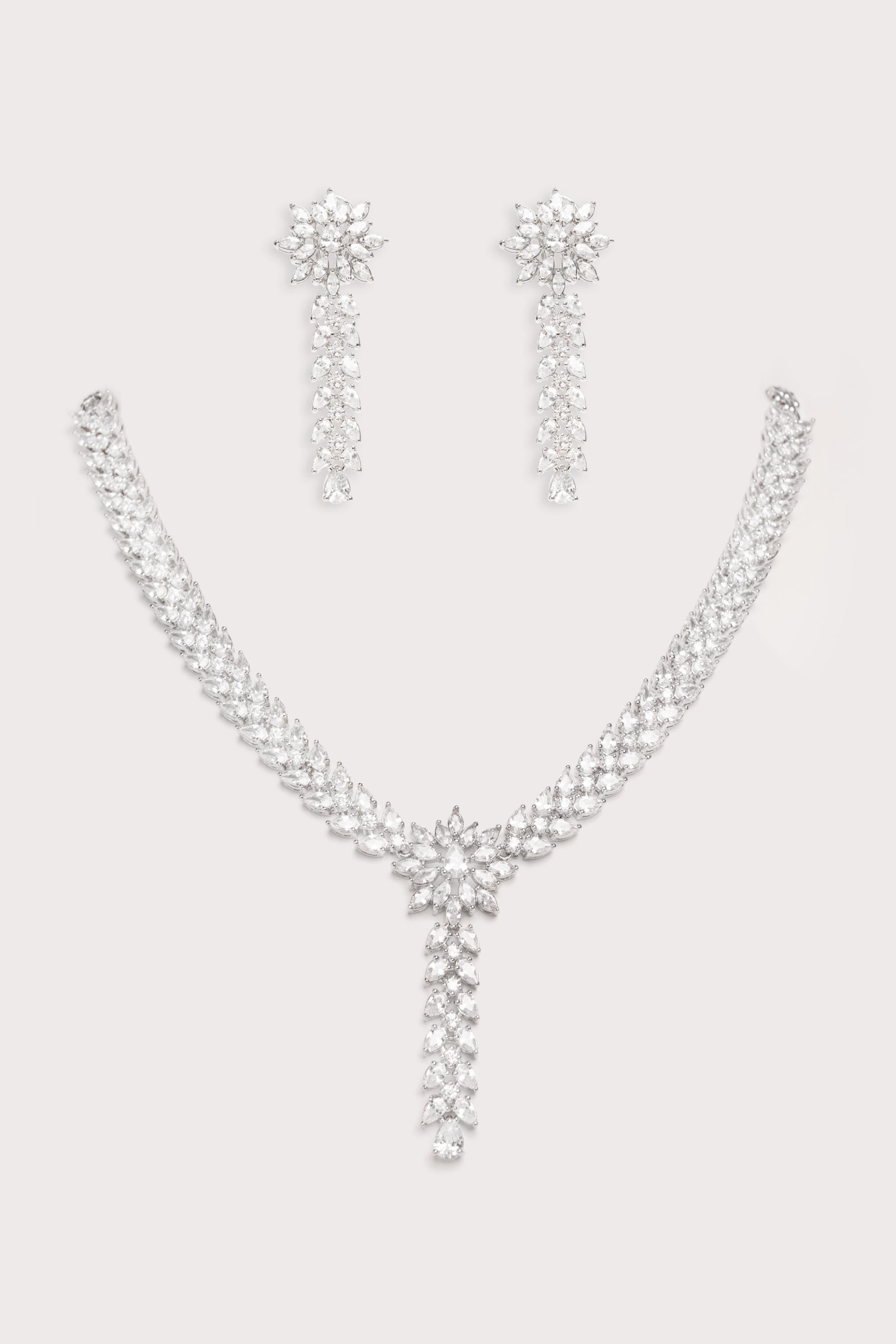 Delicate yet elegant diamond pendant necklace with matching earrings
