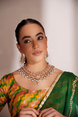 Elegant and classy kundan necklace set with earrings studded with pearls