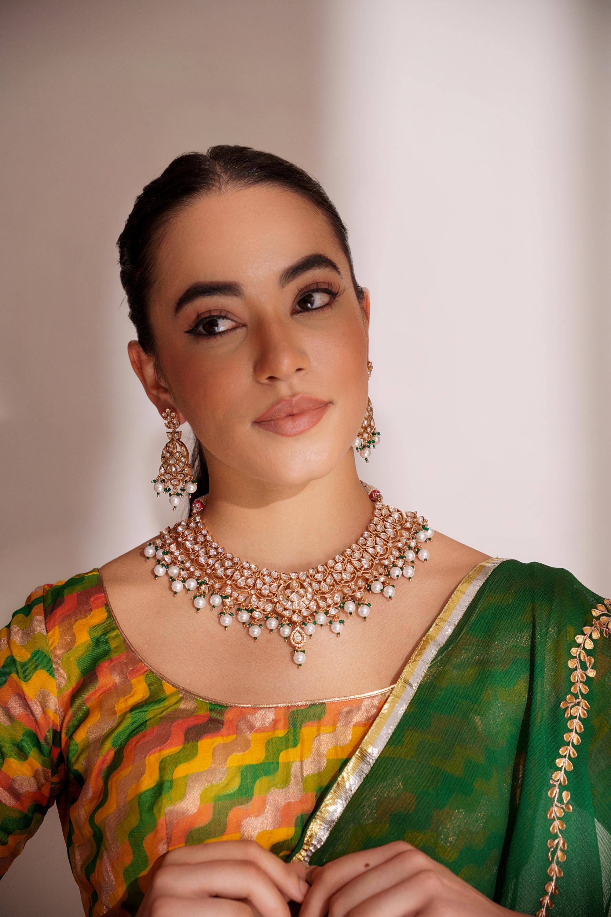 Elegant and classy kundan necklace set with earrings studded with pearls